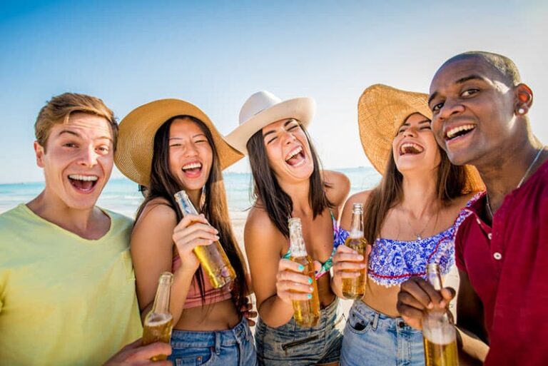 group of friends having fun on the beach