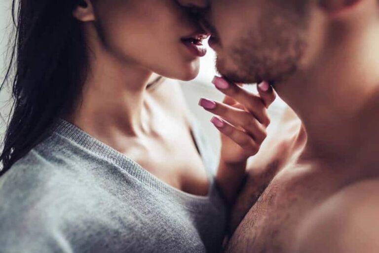 a man and a woman kiss