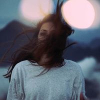 the wind waves woman's hair