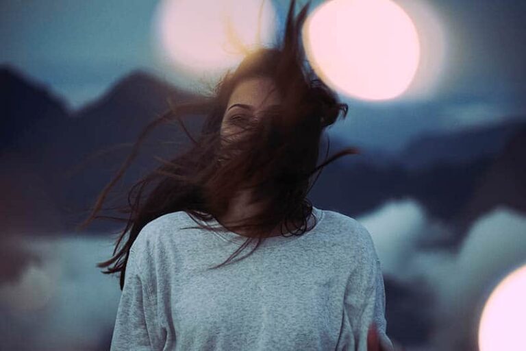 the wind waves woman's hair