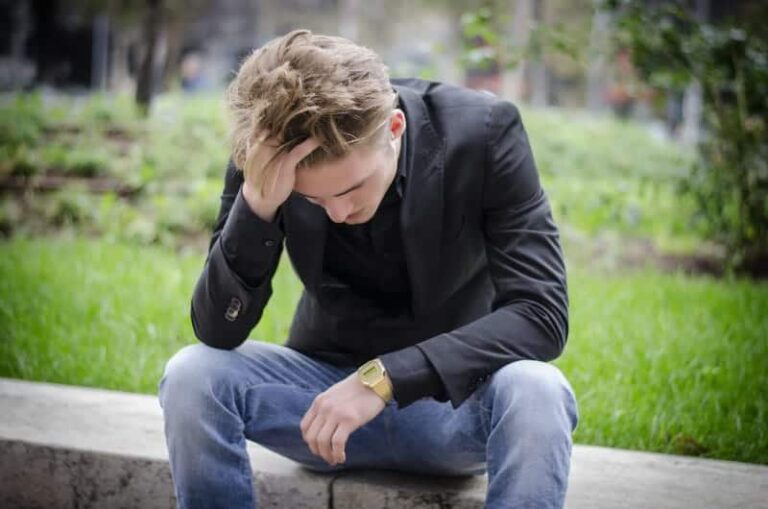 worried guy holds for head