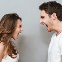 man and woman yelling at each other