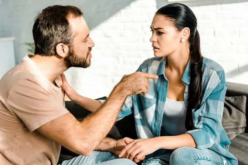 angry man pointing finger on woman