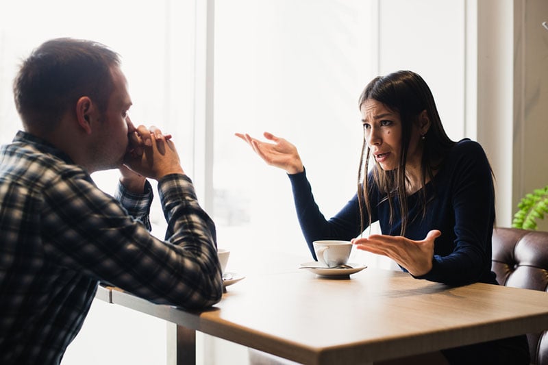 angry woman talking to man