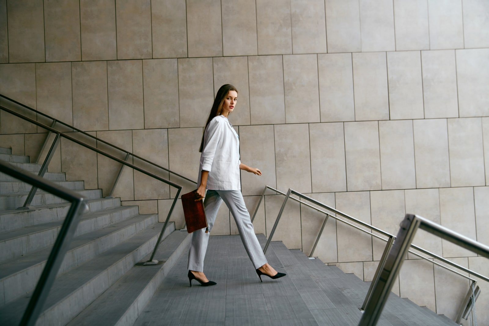 confident woman walking down stairs