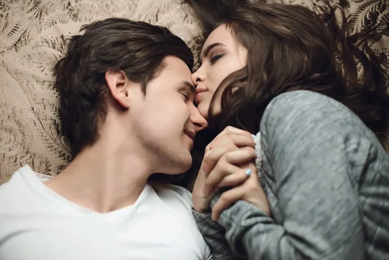 couple in love laying together with closed eyes