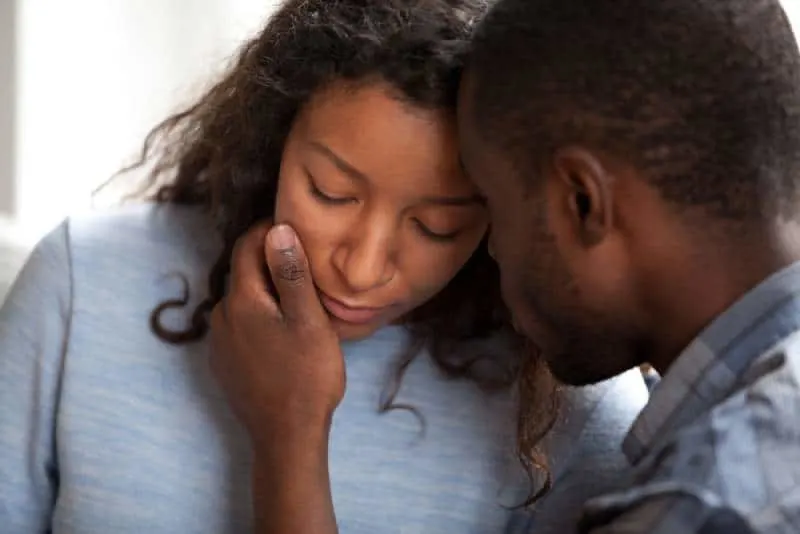 husband apologizing sad wife