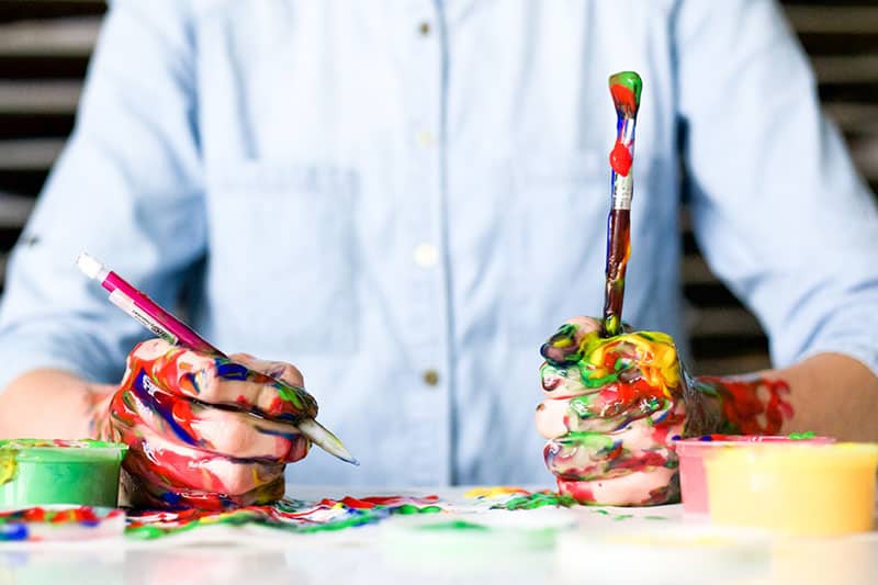 man painting on the desk