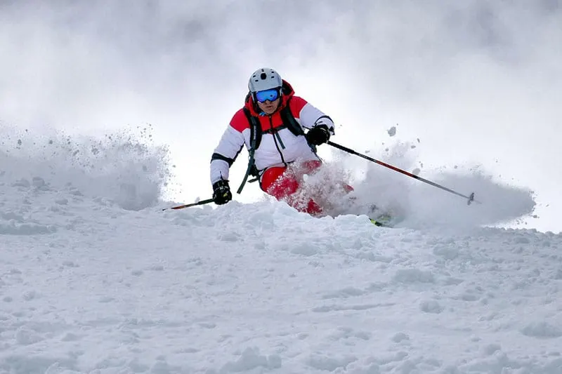 man skiing on the snow