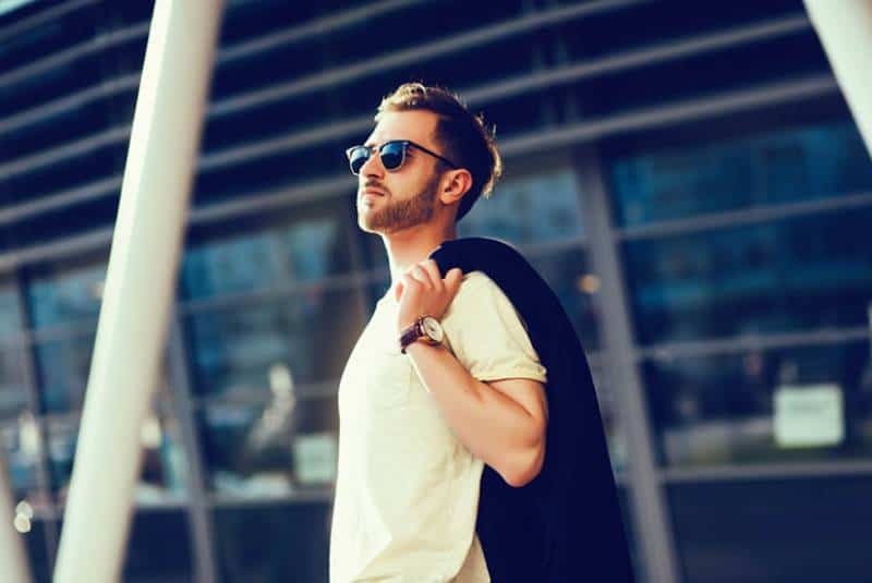 man with casual outfit standing outside