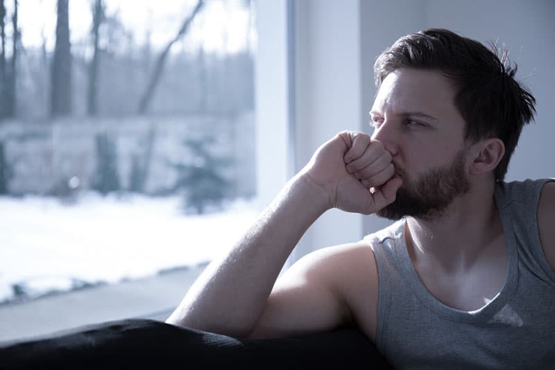 sad man sitting in the living room