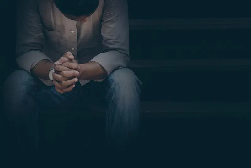 sad man sitting on stairs