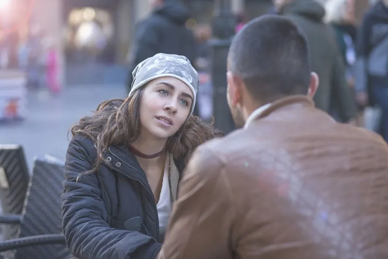 sad woman looking at man