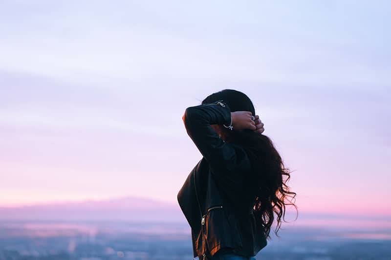 scared woman standing alone