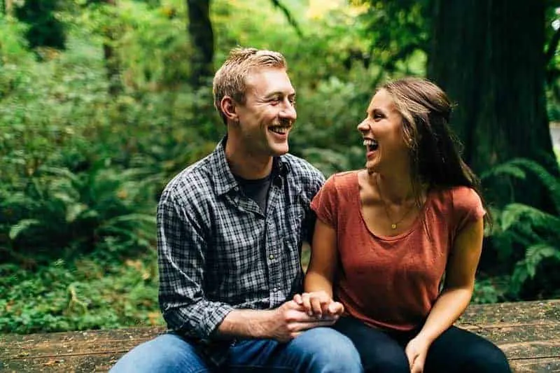 smiling couple talking in nature