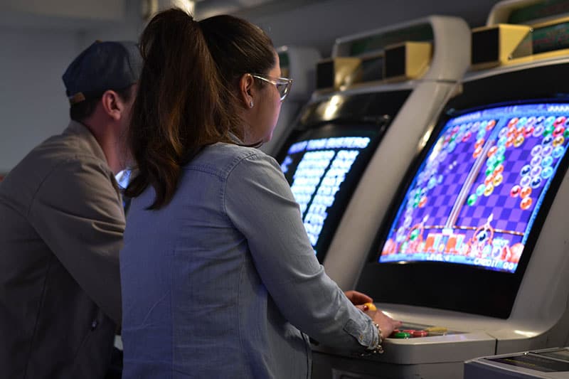 woman playing video game on the machine