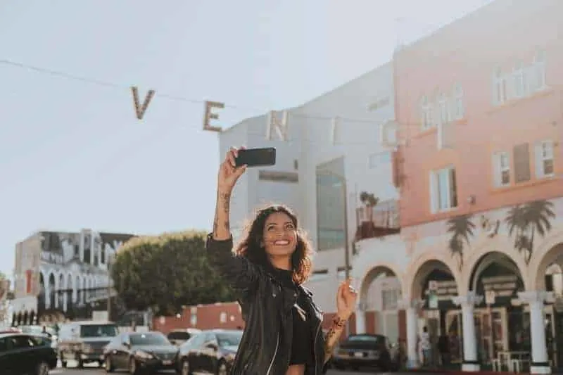 woman taking selfie outside