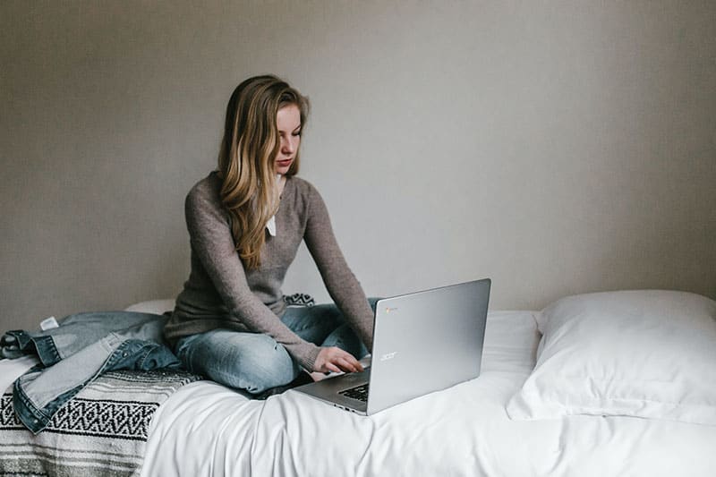 woman typing on laptop