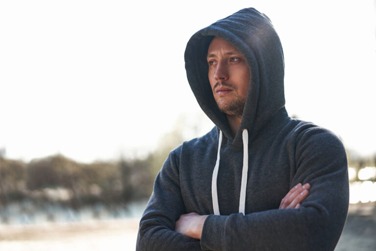 serious man wearing hoodie