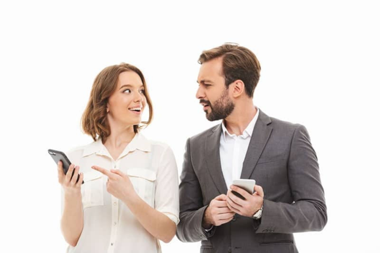 a man and a woman hold phones in their hands while a man looks at a woman in confusion