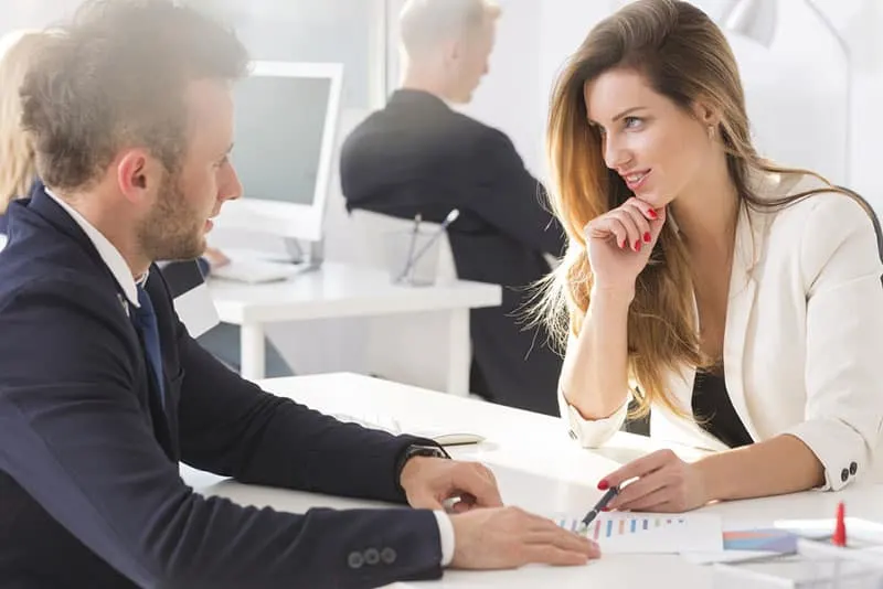 bussines woman flirting with man in office