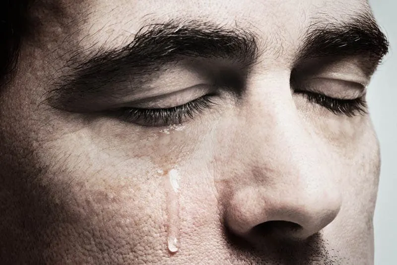 close-up photo of crying man
