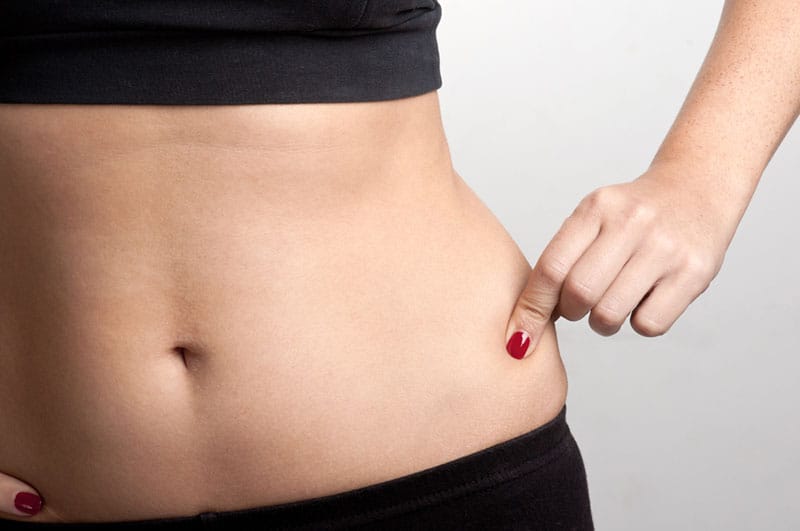 close up photo of woman holds umbly fat