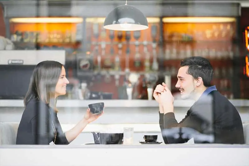 couple drinking coffee and smiling