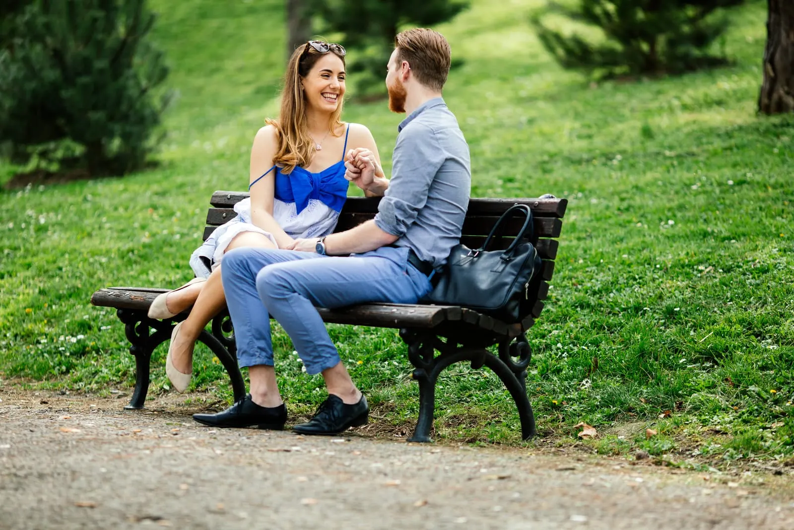 couple in love sitting on park bench