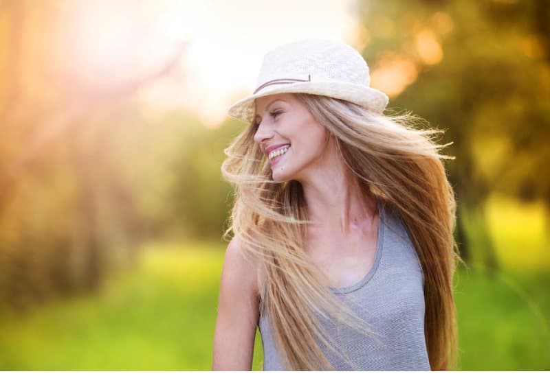 happy young girl outside smiling