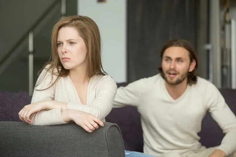 man trying to talk with sad woman