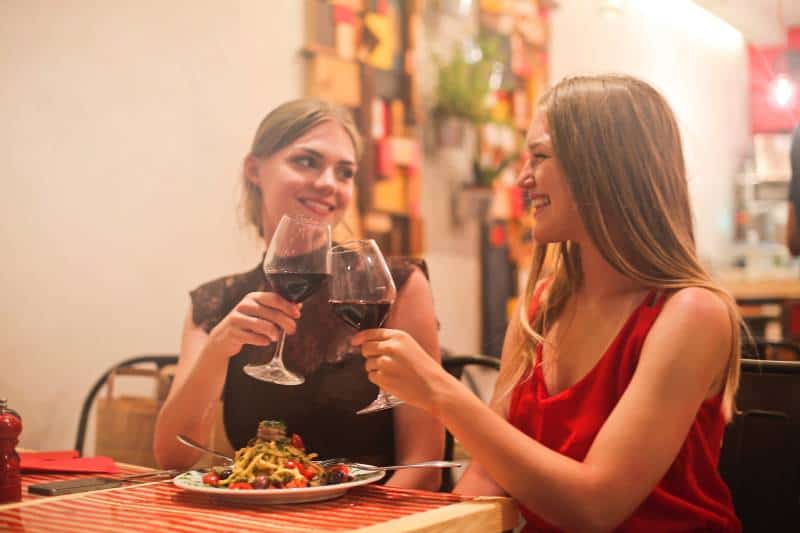 smiling female friends at restauran