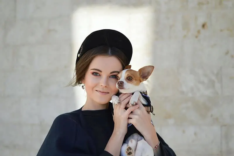 woman posing with her dog