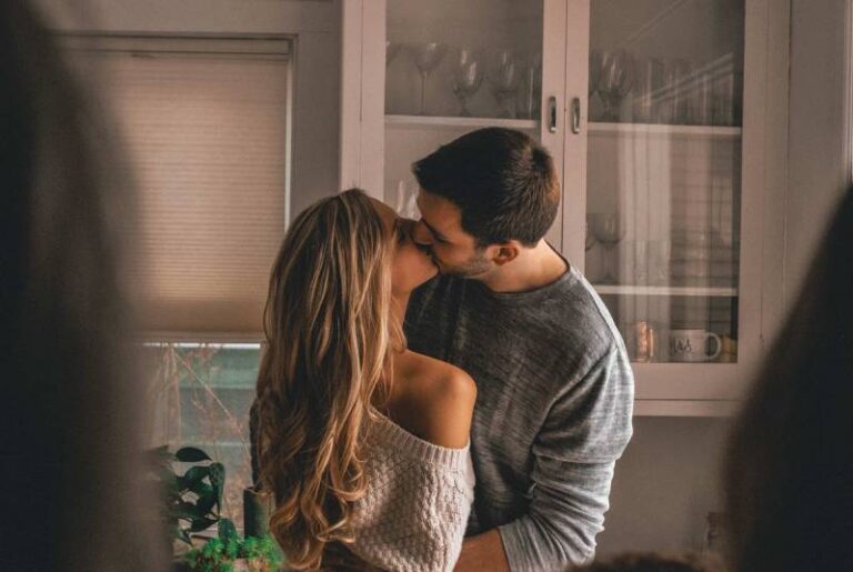 lovely couple kissing at home