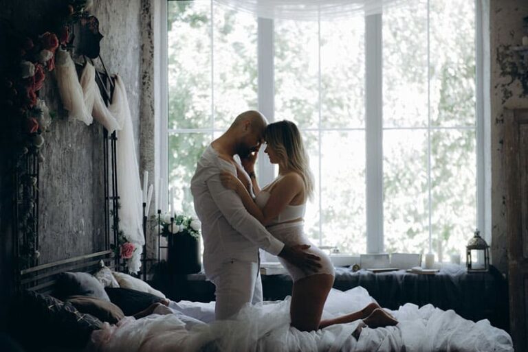 couple cuddling on bed