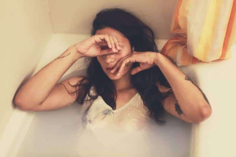 sad woman in bathtub