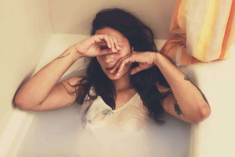 sad woman in bathtub
