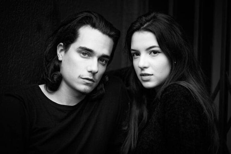 a man and a woman stand side by side