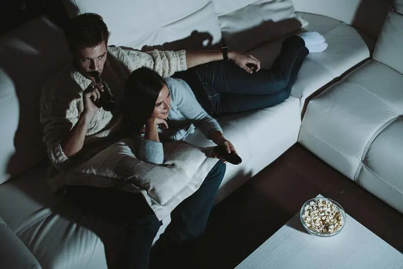 couple watching a movie at night
