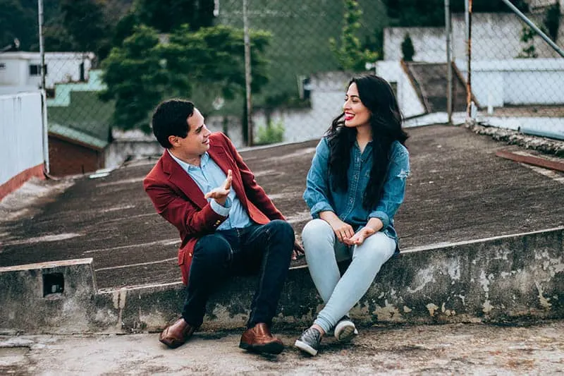 man and woman talking