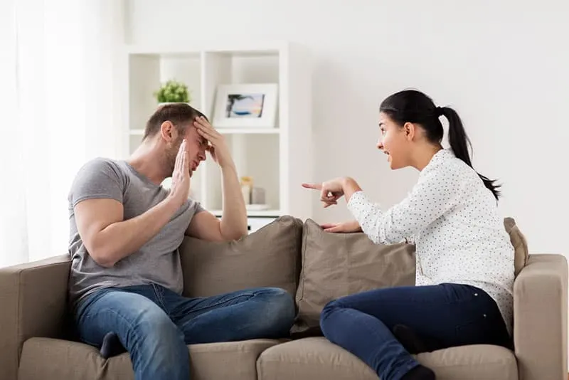 man trying to defense from arguing by her woman