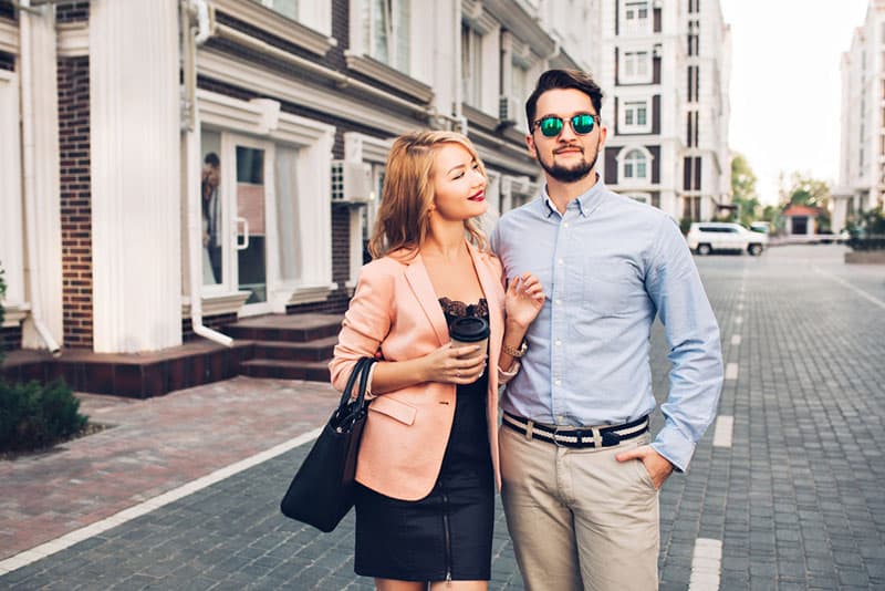 portrait of man and woman standing on street