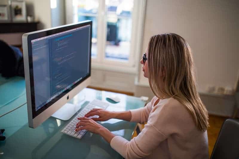 woman typing on laptop