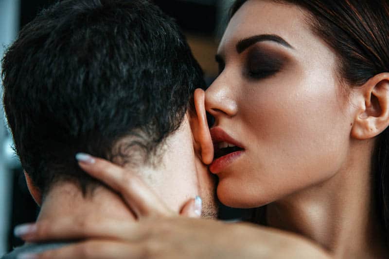 woman's lips on man ear