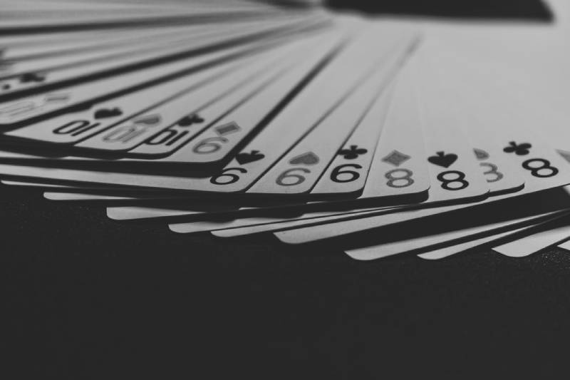 grayscale of a fanned playing cards