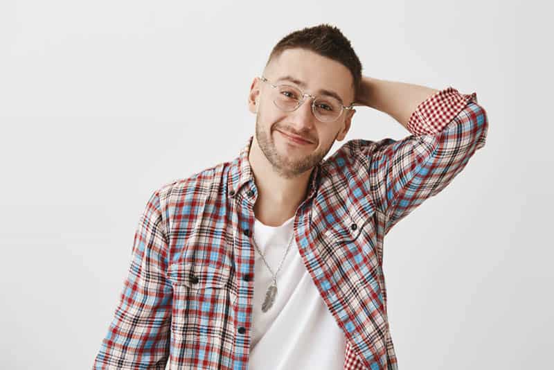 man with eyeglasses and plaid shirt