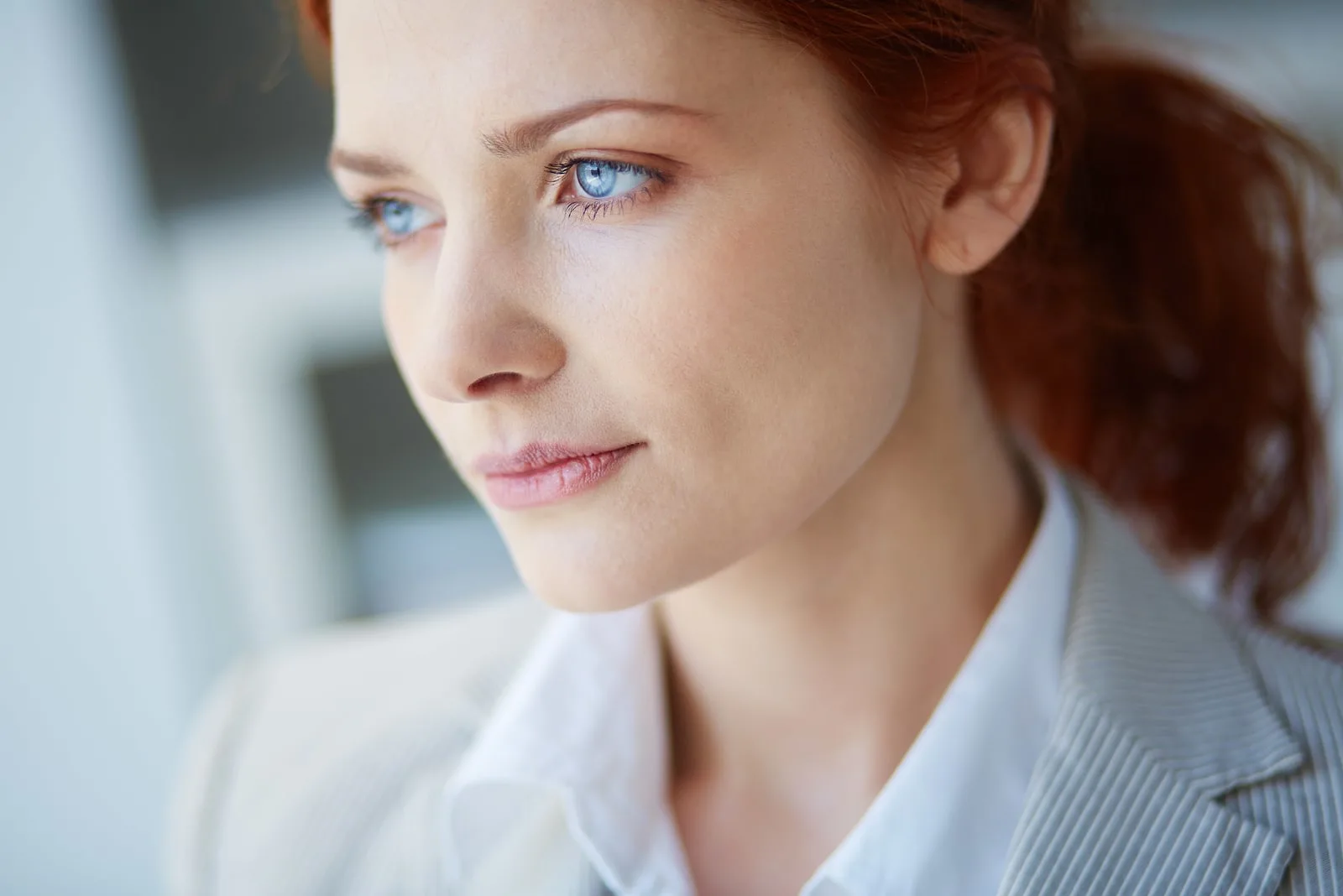 pensive woman with blue eyes