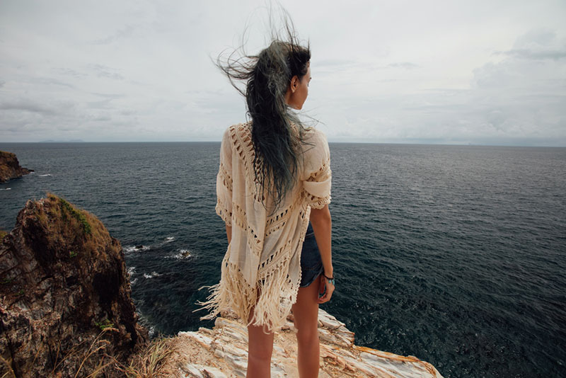 young woman standing in wind