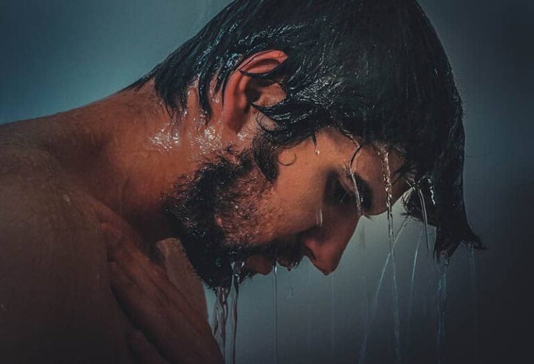 side view of man's face while having shower