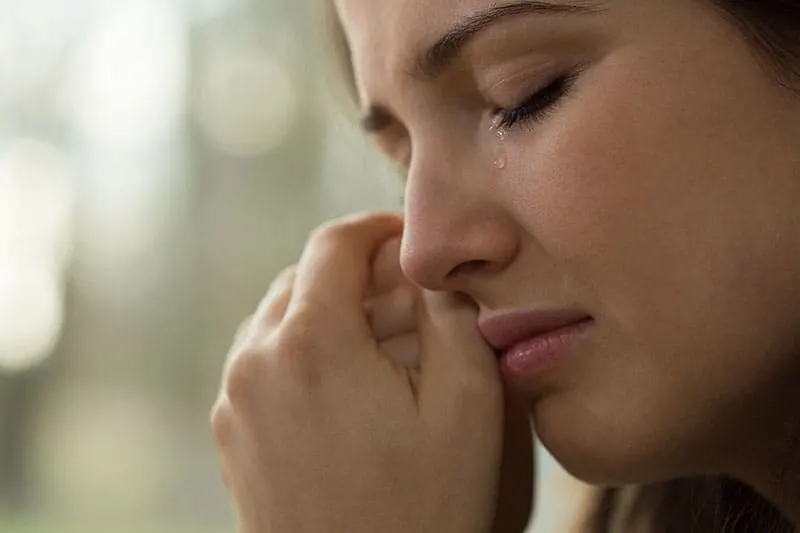 close up photo of crying woman